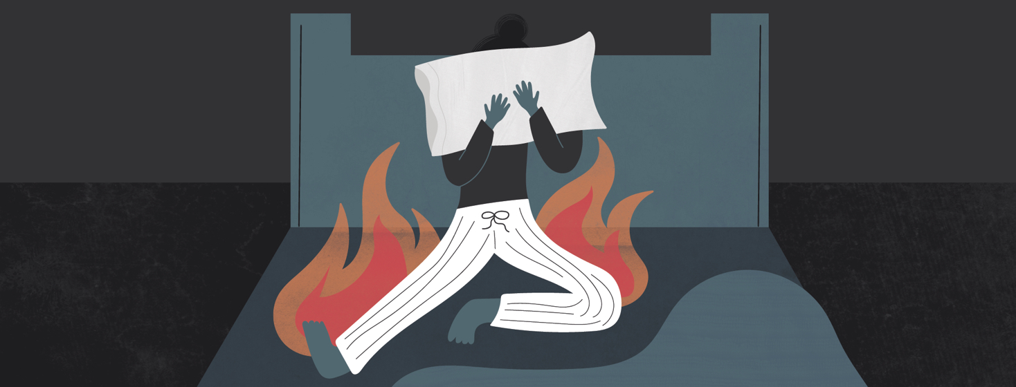 a woman sitting in her bed with a pillow over her face and flames around her legs