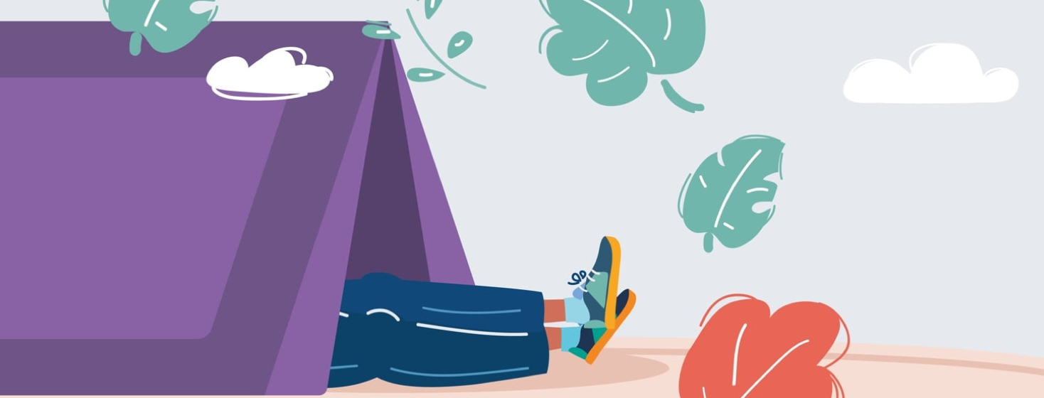 a person camping with their legs sticking out of the tent they are sleeping in