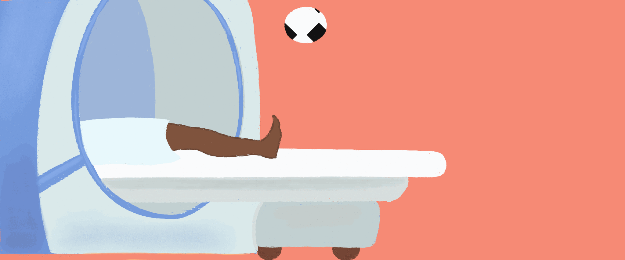 A person in a MRI kicks a soccer ball